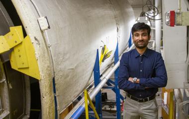 Yashvardhan standing in front of an air tunnel